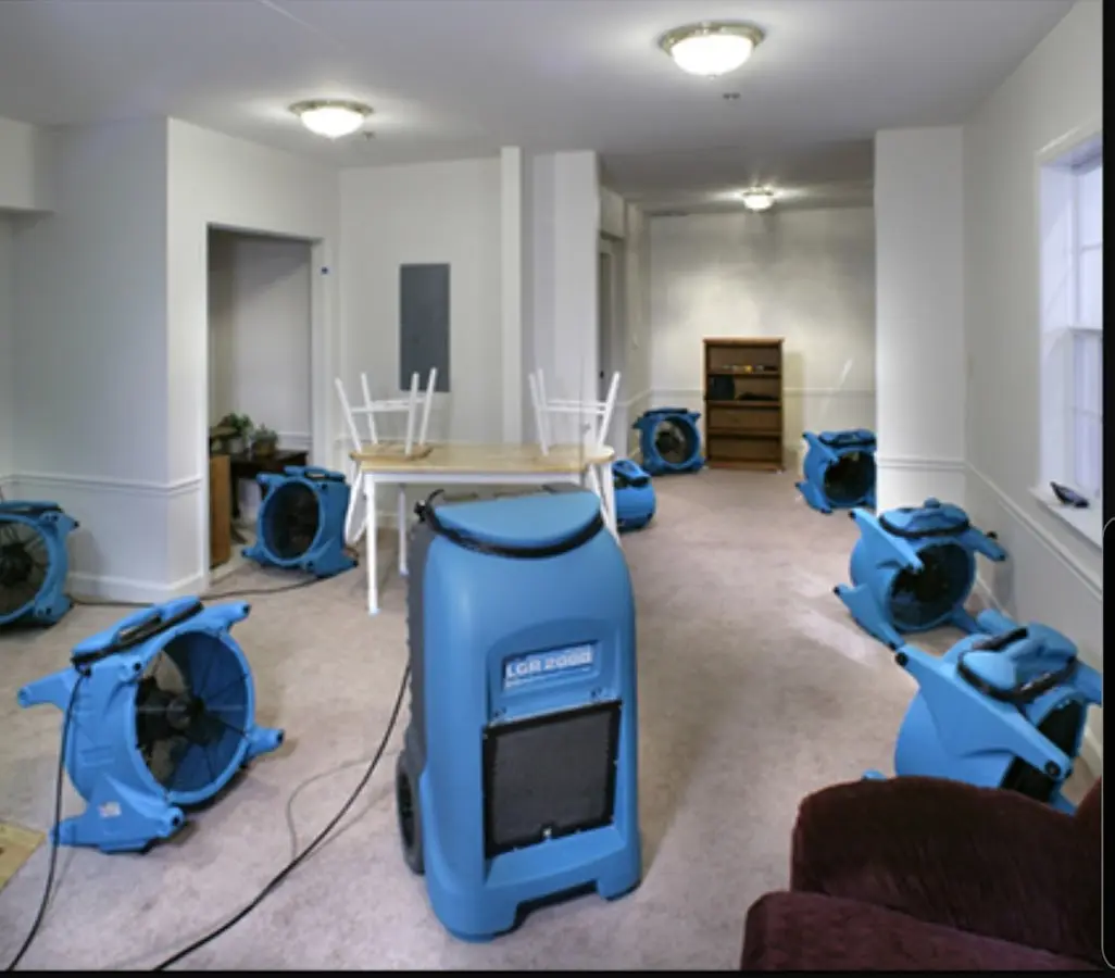 Air movers and dehumidifier setup for Water Damage Restoration in Sullivan